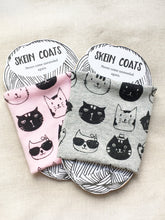 one of each color pink and gray screen printed skein coats on their packaging