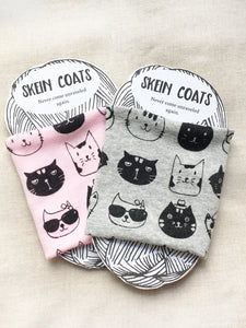 one of each color pink and gray screen printed skein coats on their packaging