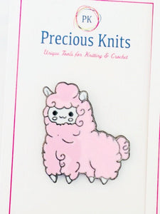 Pink enamel sheep pin on its packaging card
