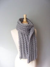 Bulky monterey scarf pattern shown in gray on a mannaquin