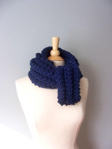 navy blue monterey scarf shown wrapped around the neck several times