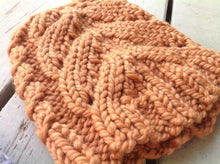 detailed view of the cable pattern used in this knitted hat design